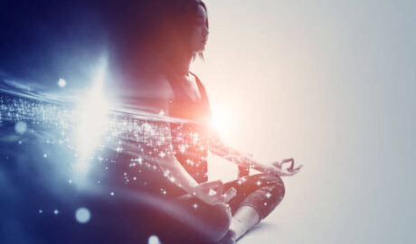 woman meditating with stars