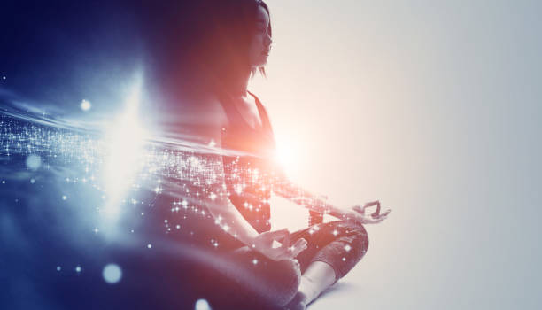 woman meditating with stars