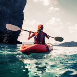 woman in red kayak